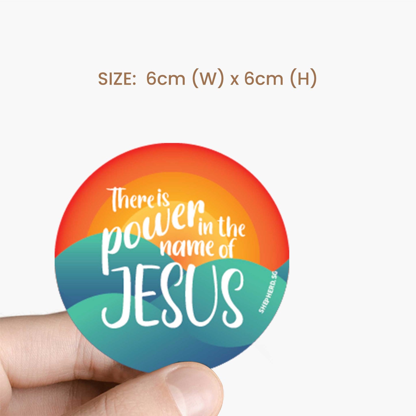 Vibrant sun and waves sticker with 'There is power in the name of Jesus' text held by a hand, size 6cm x 6cm.