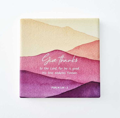 christian square ceramic coaster psalm 136:1 give thanks to the lord on white background
