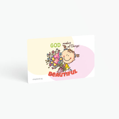 A curved corner wallet card size sticker for children standing in landscape on a white background with text "God makes all things beautiful"