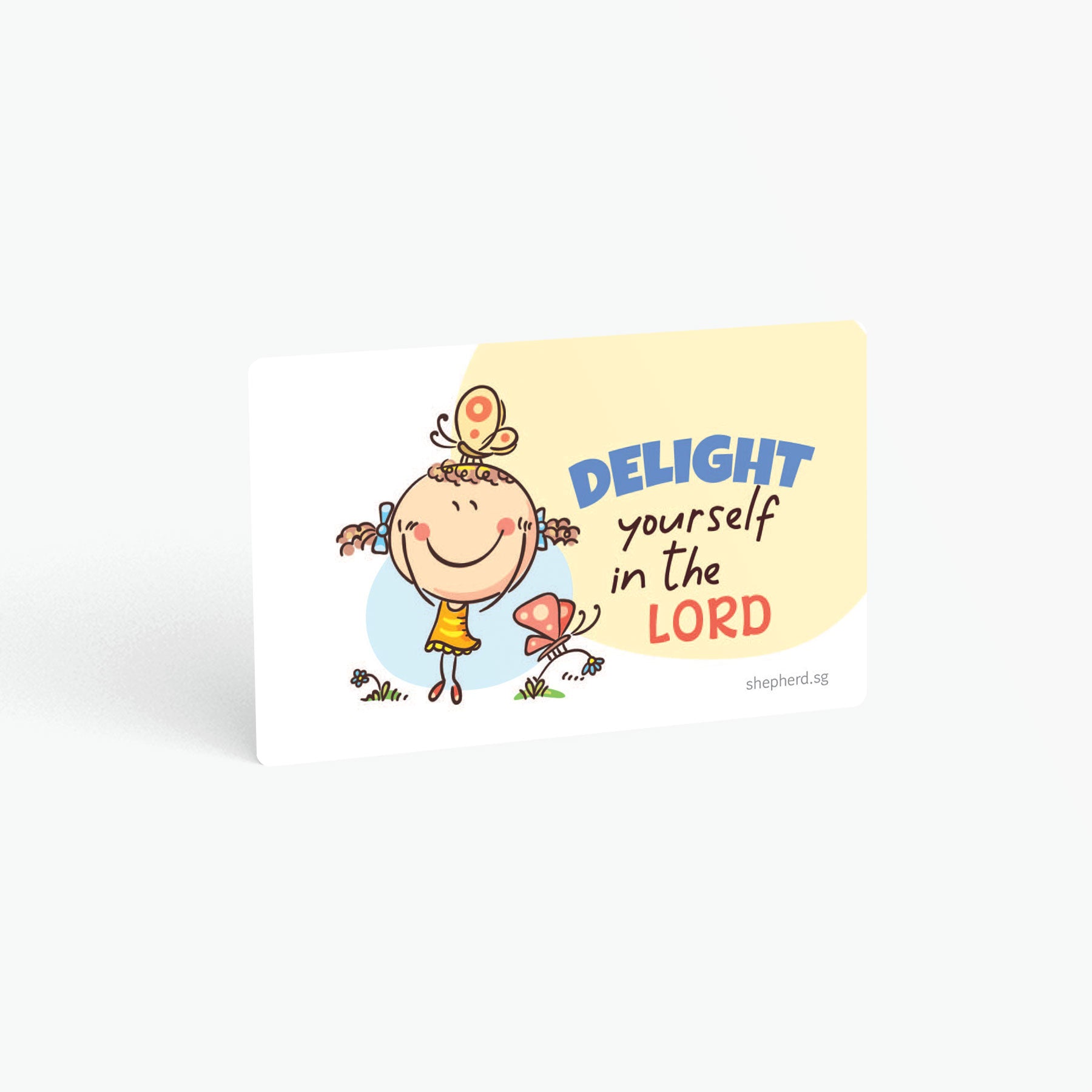 A curved corner wallet card size sticker for children standing in landscape on a white background with text "Delight yourself in the Lord"