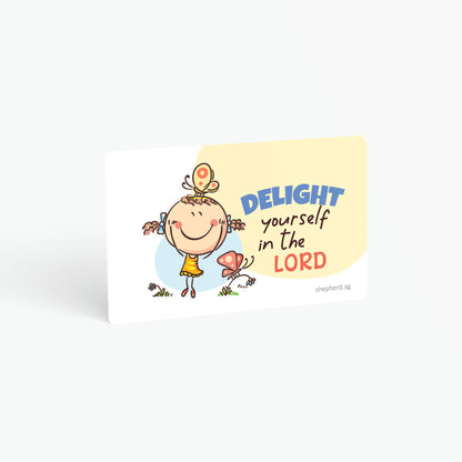 A curved corner wallet card size sticker for children standing in landscape on a white background with text "Delight yourself in the Lord"