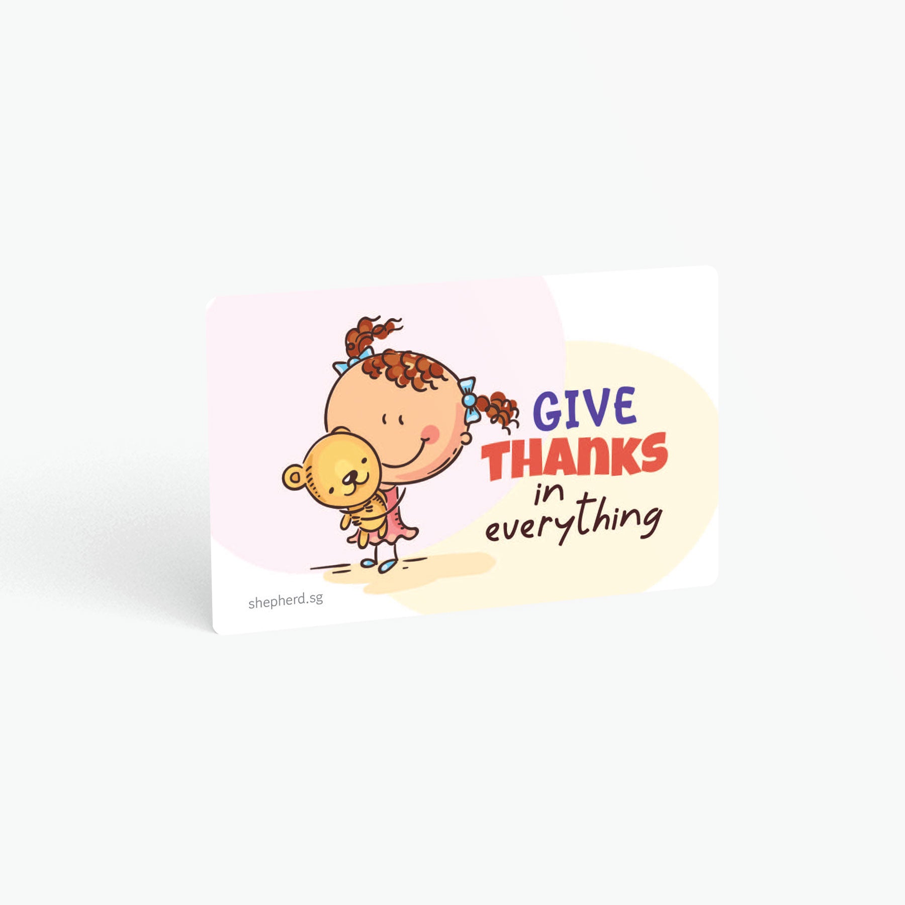 A curved corner wallet card size sticker for children standing in landscape on a white background with text "Give thanks in everything"