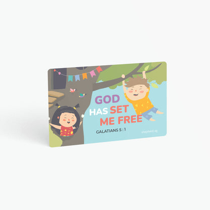 A curved corner wallet card size sticker for children standing in landscape on a white background with text "God has set me free" Galatians 5:1