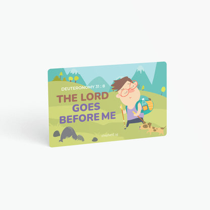 A curved corner wallet card size sticker for children standing in landscape on a white background with text "The Lord goes before me" Deuteronomy 31:8