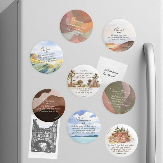 decorative button magnets with bible verses and scenic designs on a refrigerator