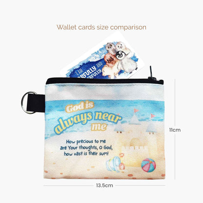 Small zipper pouch with bible verse and cartoon characters, containing card, on a white background.