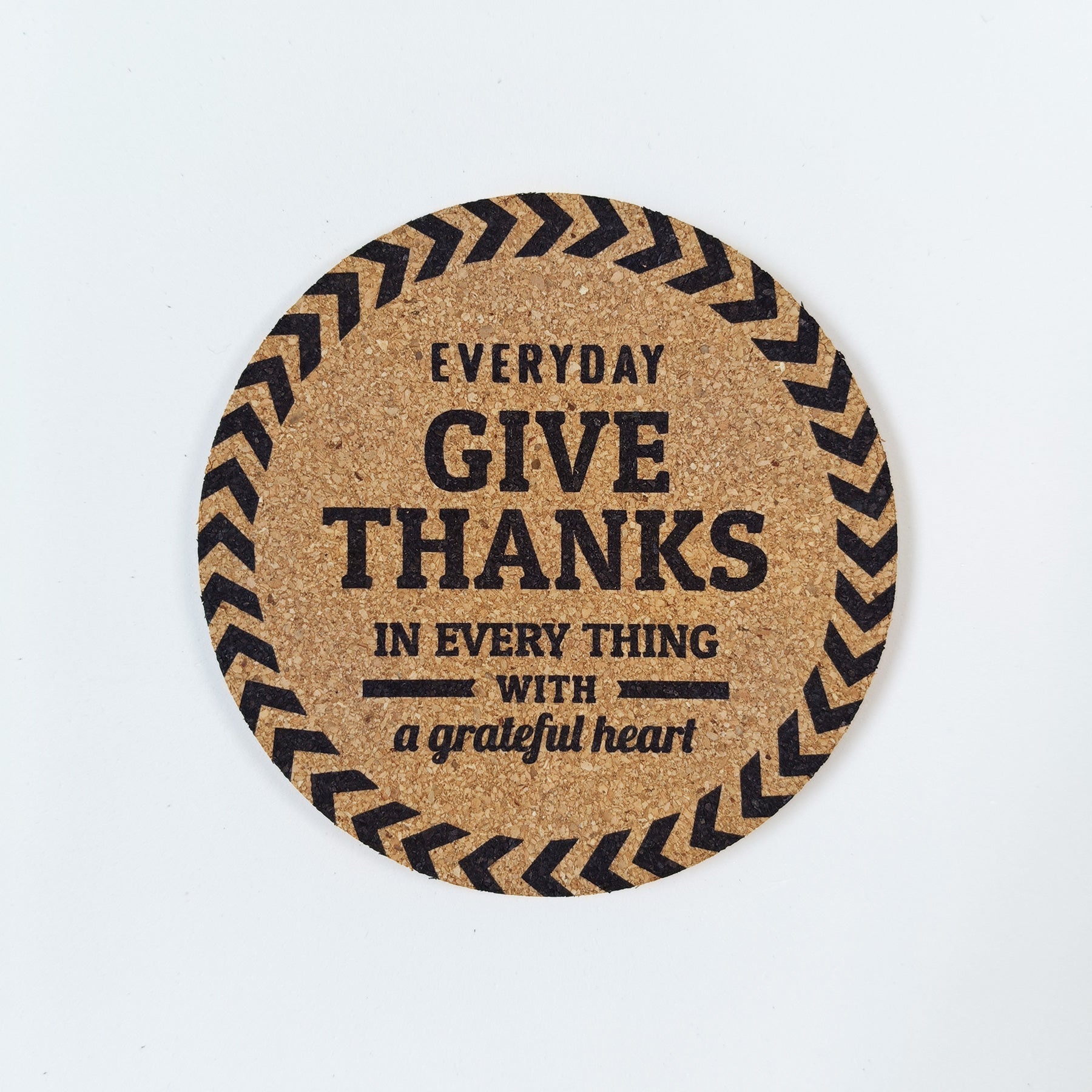 Circle cork coaster with Bible message Give thanks in every thing  on a white background