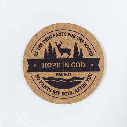 Circle cork coaster with Bible verse Psalm 42 and deer design on a white background