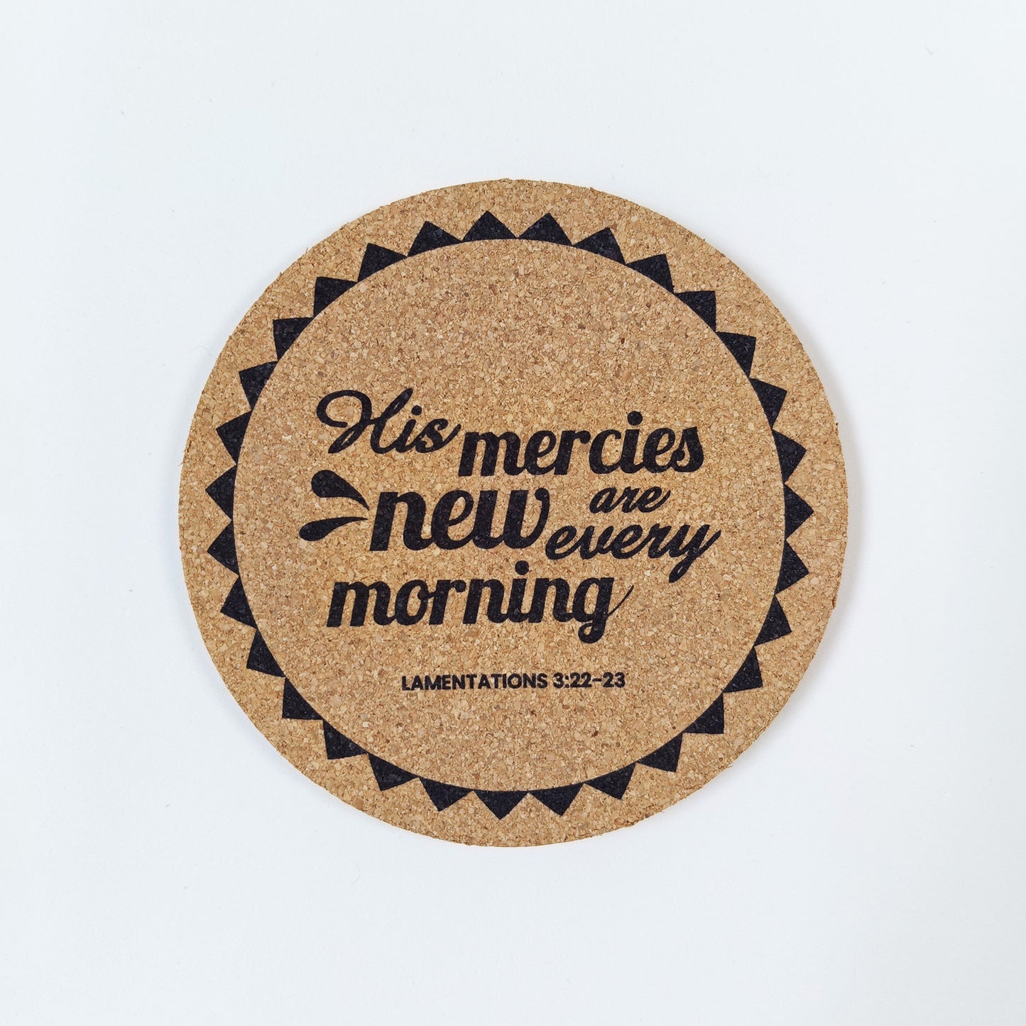 Circle cork coaster with Bible verse Lamentations 3 His mercies are new every morning on a white background