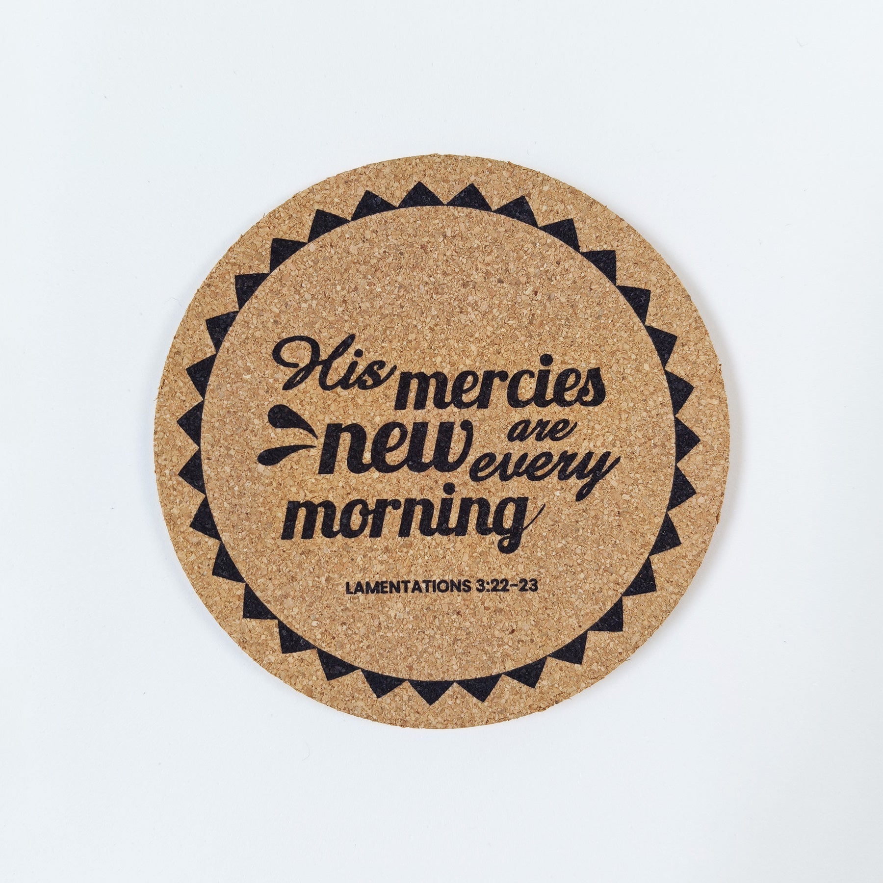 Circle cork coaster with Bible verse Lamentations 3 His mercies are new every morning on a white background