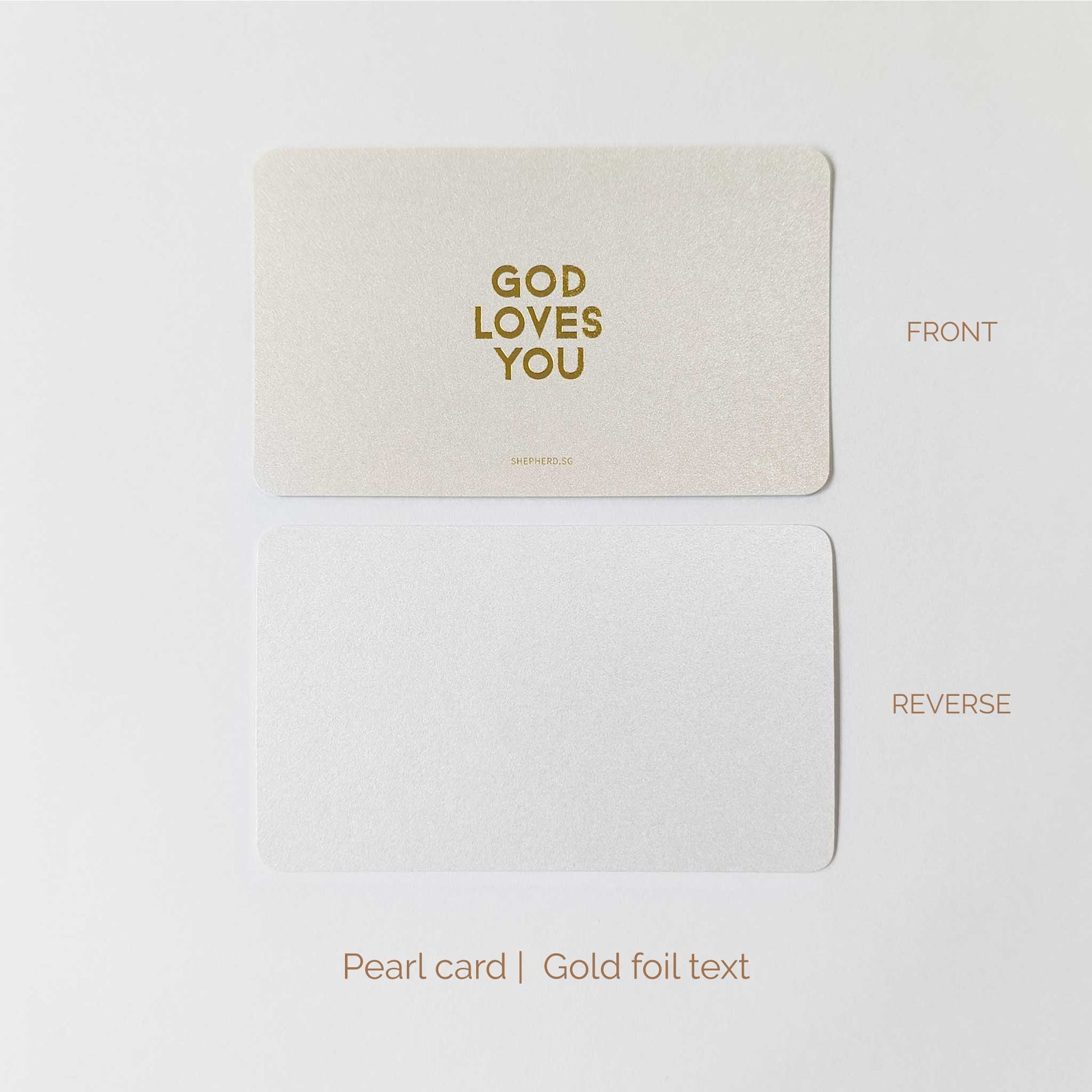 Pearl card with gold foil text 'GOD LOVES YOU' on a white background, shown from front and reverse sides.