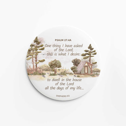 flat round button magnet with bible verse one thing i have asked of the lord on white background with watercolor elements