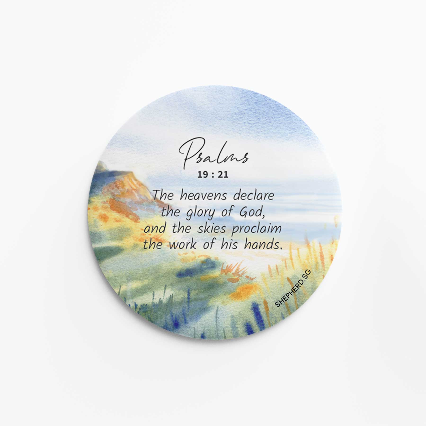 flat round button magnet with bible verse the heavens declare the glory og God on landscape nature background