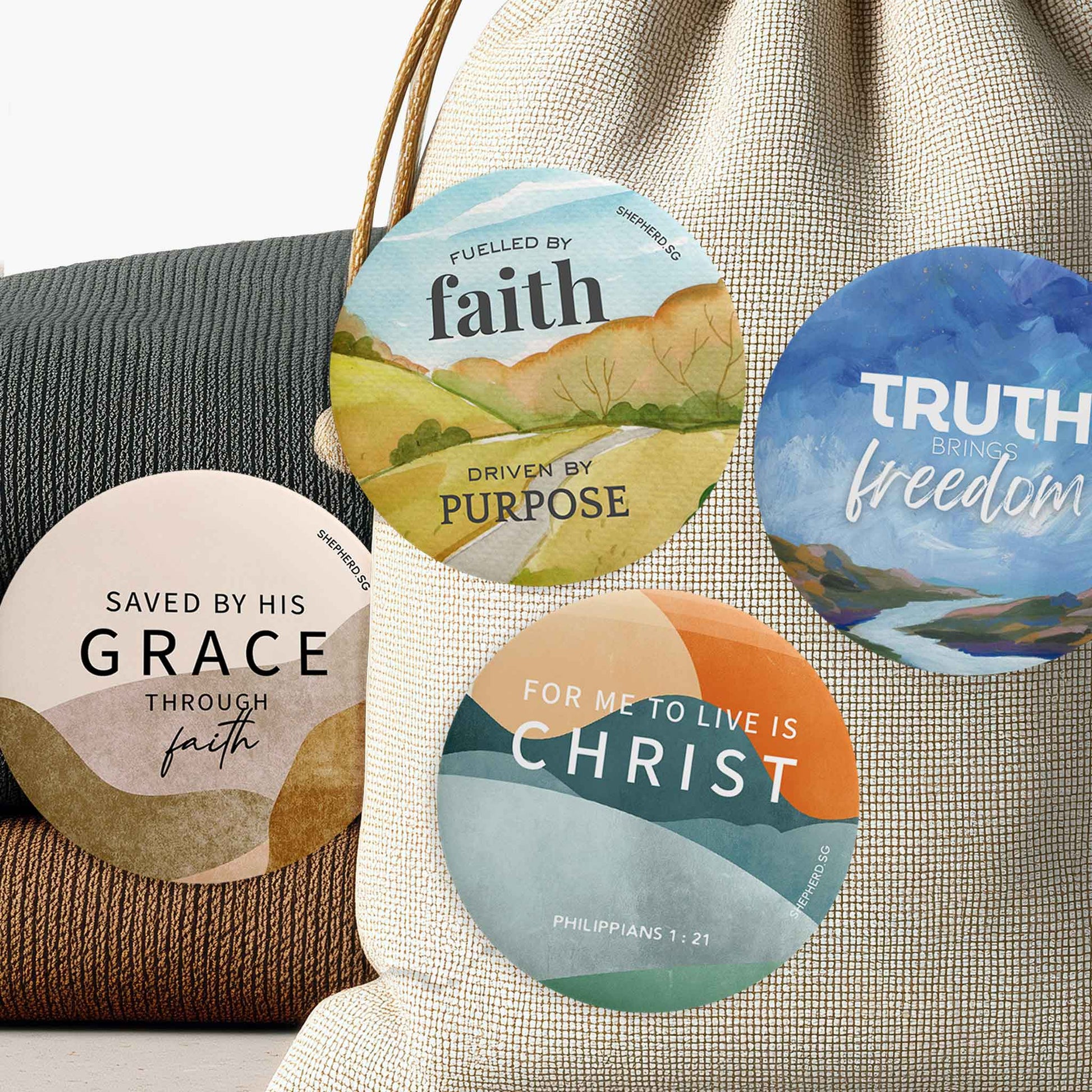 four unisex pin christian pin badges pinned on fabrics