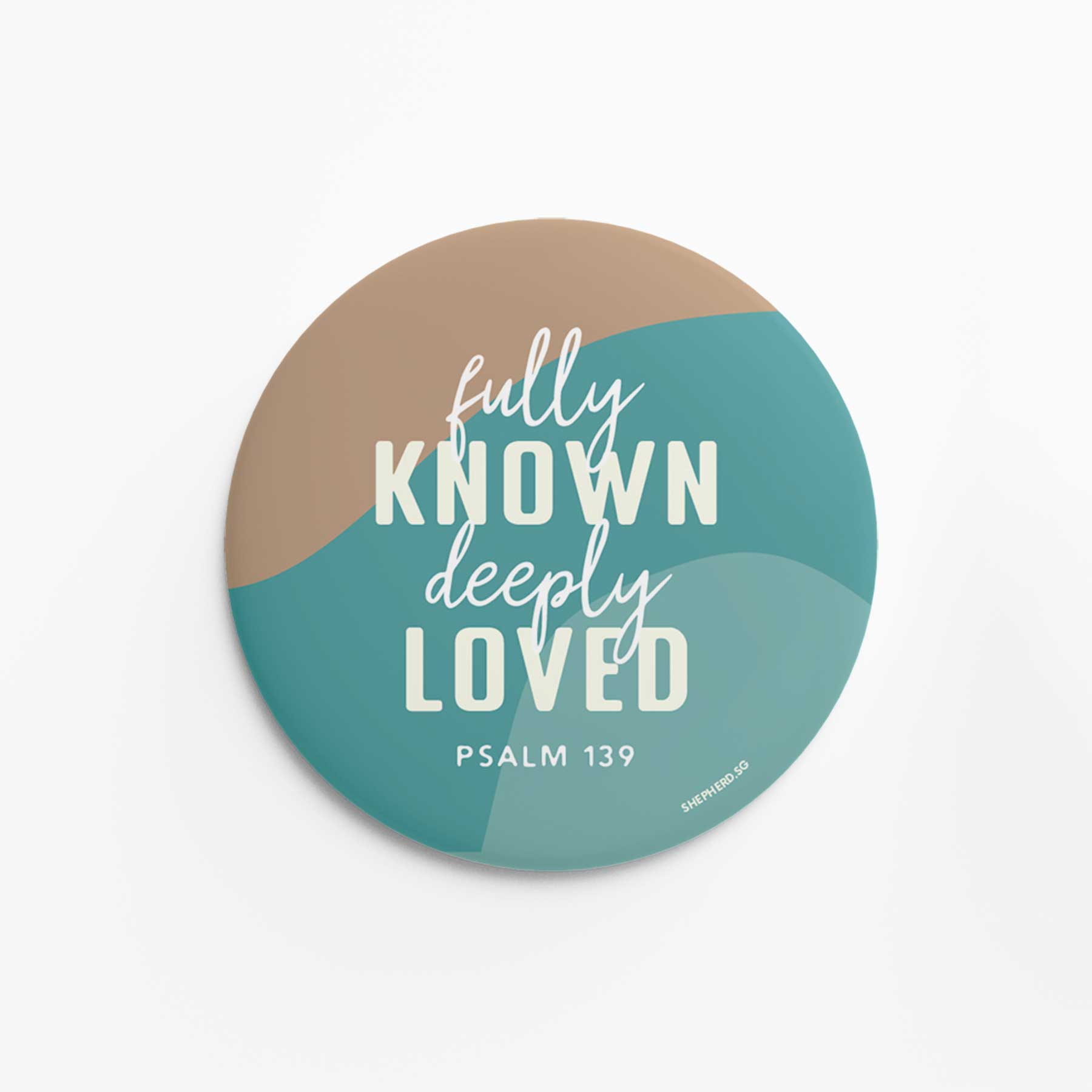 Round pin badge with 'fully known deeply loved Psalm 139' text on a two-tone background