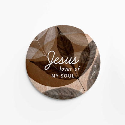 Round pin badge with leaf pattern and 'Jesus lover of my soul' text on a white background