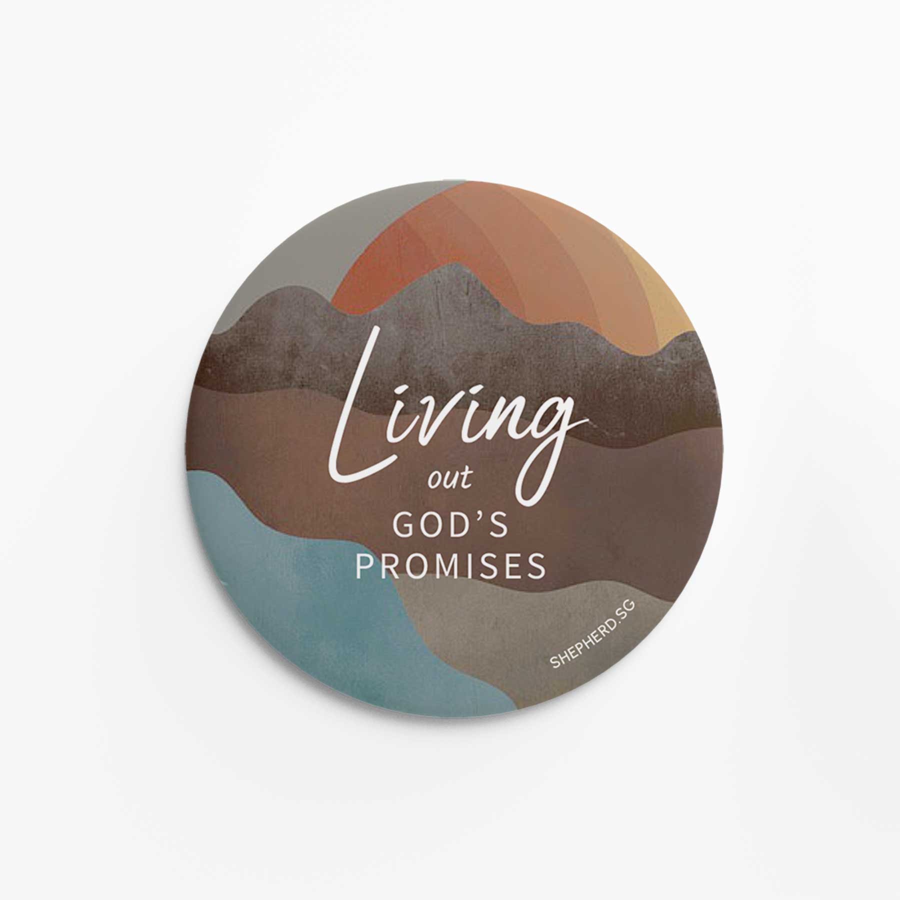 Round pin badge with abstract mountain design and 'Living out GOD'S PROMISES' text on a white background