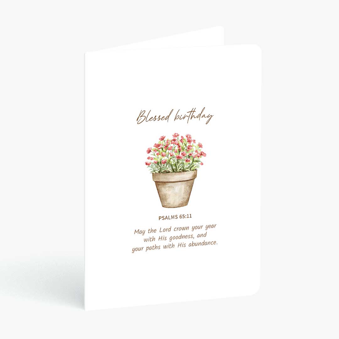 Christian greeting card blessed birthday with bible verse from Psalms and pot of roses on a white background