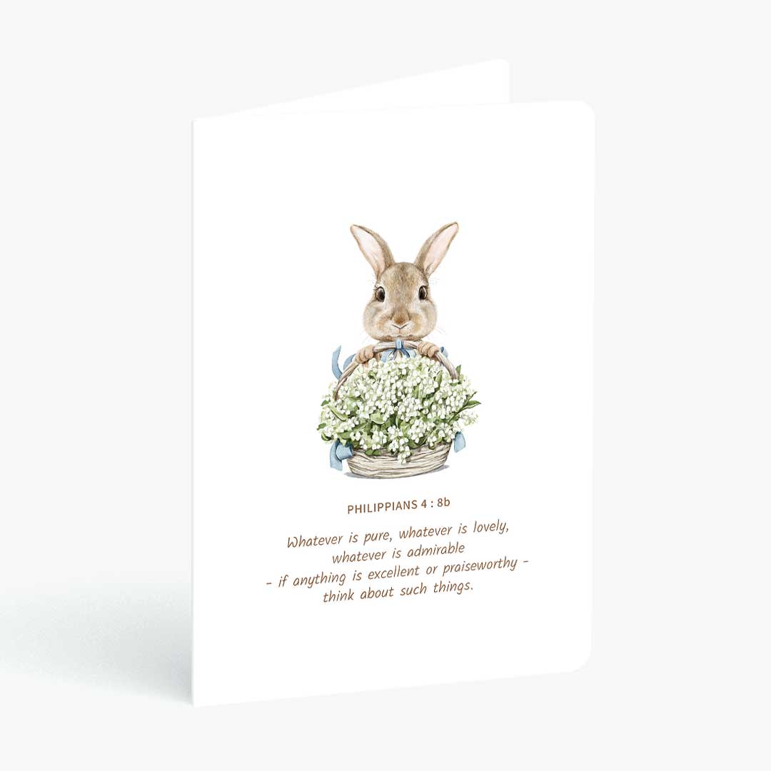 Christian greeting card with whatever is pure bible verse and a rabbit holding a flower basket on a white background