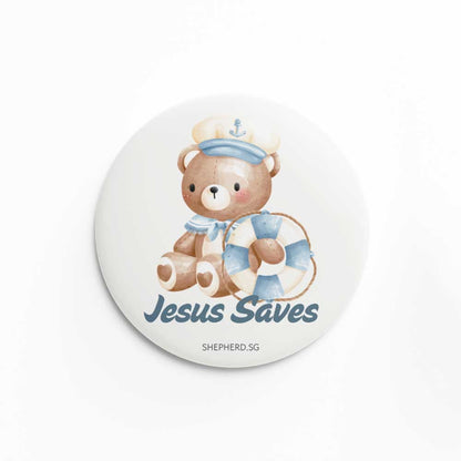 Button pin badge with sailor teddy bear design and 'Jesus saves' text on a white background