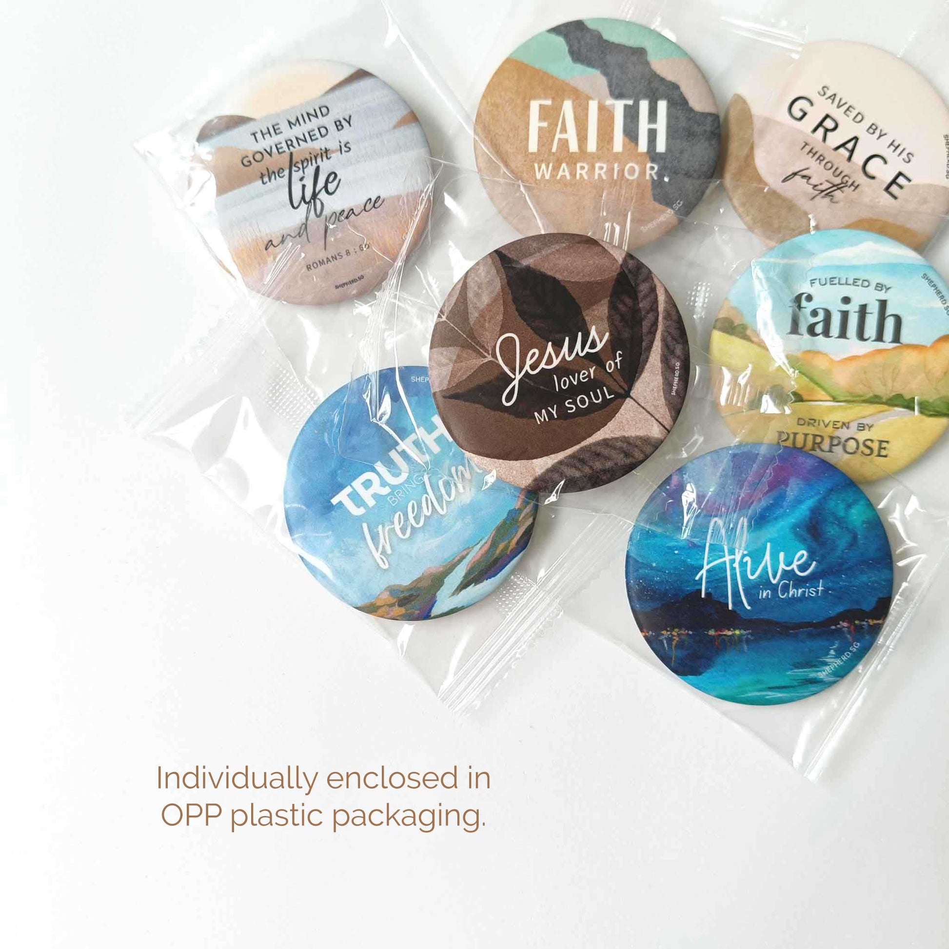 assorted designs of christian pin badges in individually enclosed OPP plastic packaging