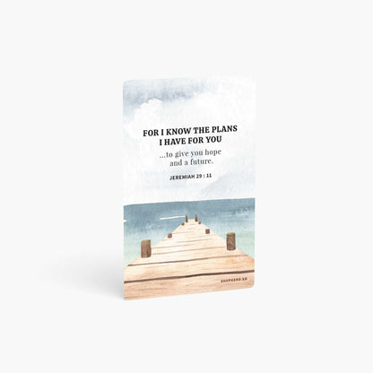 A curved corner wallet card size sticker standing vertically on a white background with Bible verse Jeremiah 29:11 For I know the plans