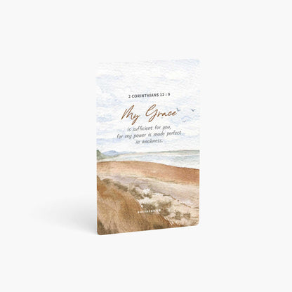 A curved corner wallet card size sticker standing vertically on a white background with Bible verse 2 Corinthians 12:9 My grace is sufficient for you