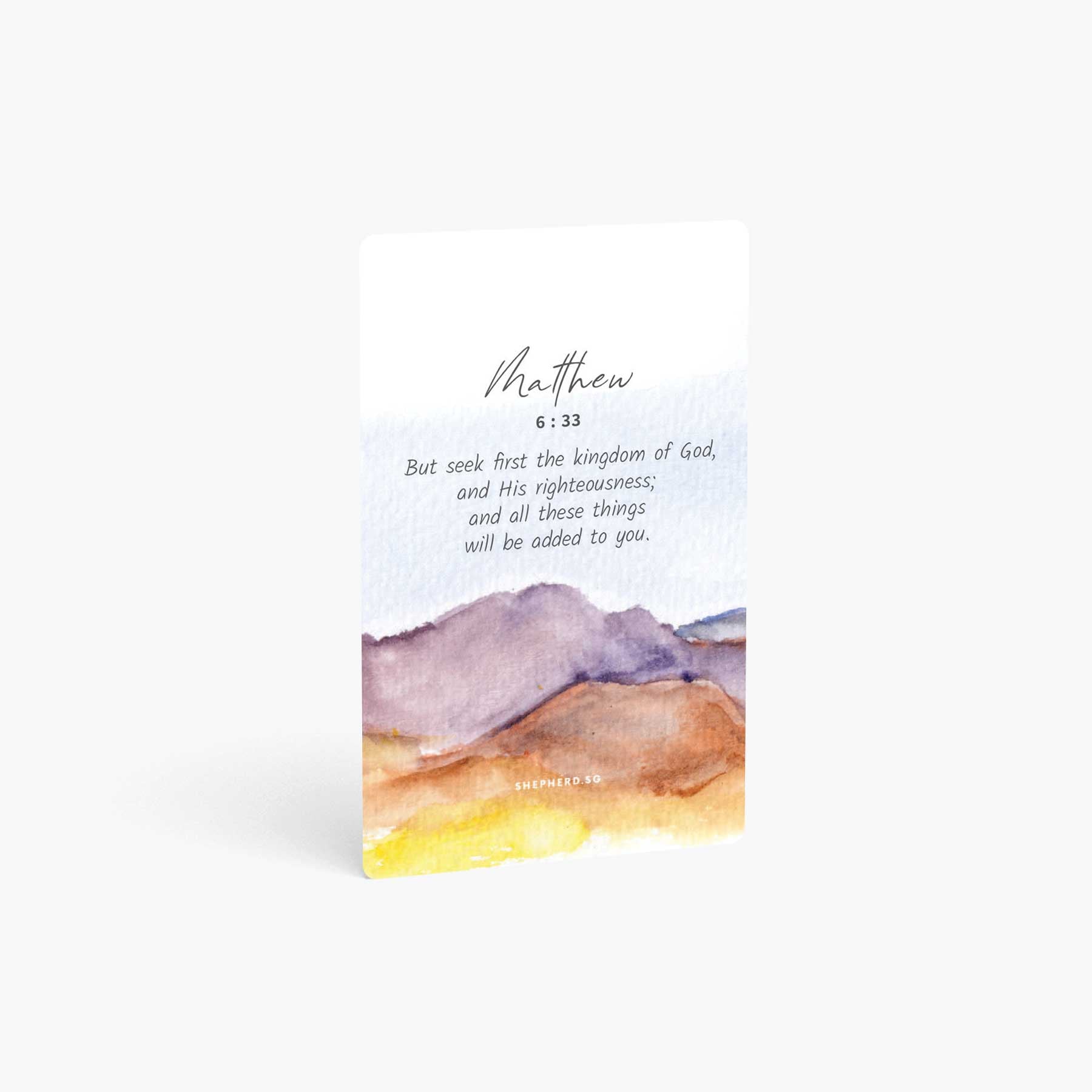 A curved corner wallet card size sticker standing vertically on a white background with Bible verse Matthew 6:33 But seek first the kingdom of God