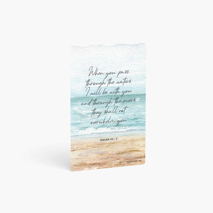 A curved corner wallet card size sticker standing vertically on a white background with Bible verse Isaiah 43:2  When you pass through the waters