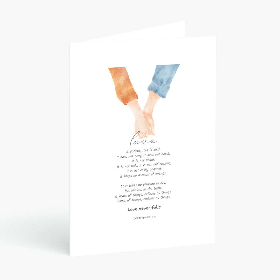 A white greeting card with a watercolor illustration of two hands holding, one in orange and the other in blue. Below the illustration is the word 'Love' in script, followed by 1 Corinthians 13 : 4-8, and the phrase 'Love never fails' at the bottom.