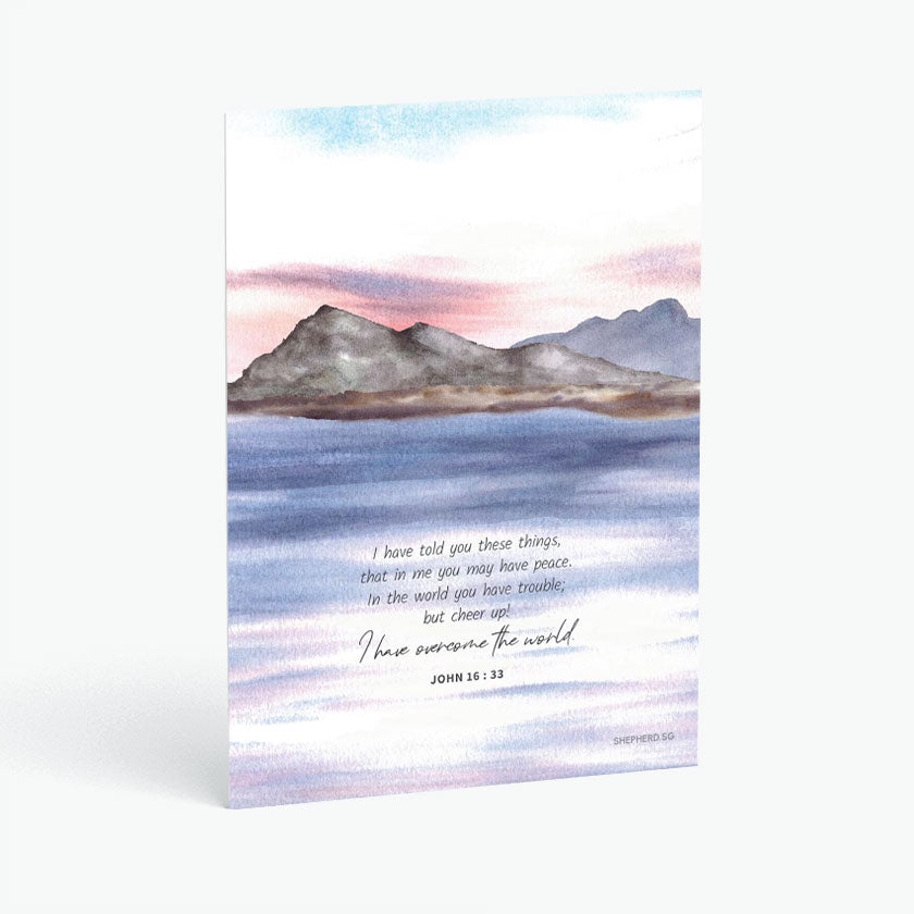 Christian postcard with Bible verse John 16:33 and watercolor design of sunset along mountain and sea