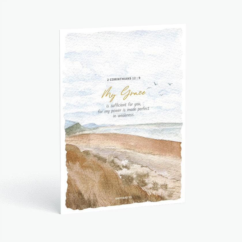 Christian postcard with Bible verse 2 Corinthians 12:9 and watercolor design of sandy beach coastline