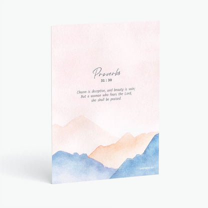Christian postcard with Bible verse proverbs 31:30 on watercolor pink background and abstract mountain lines