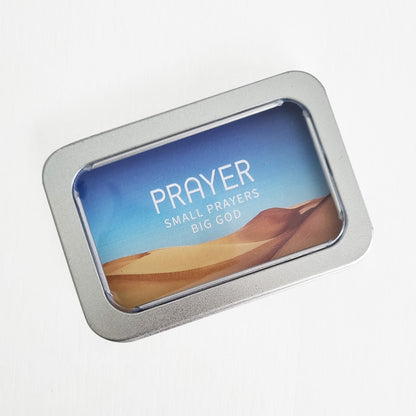 christian prayer cards set in tin box on a white background