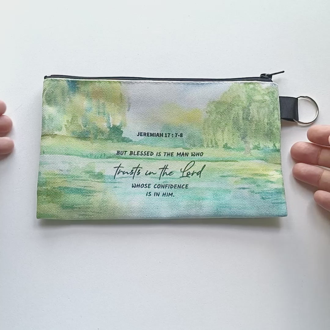video of a christian zipper pouch at all angles on a white background